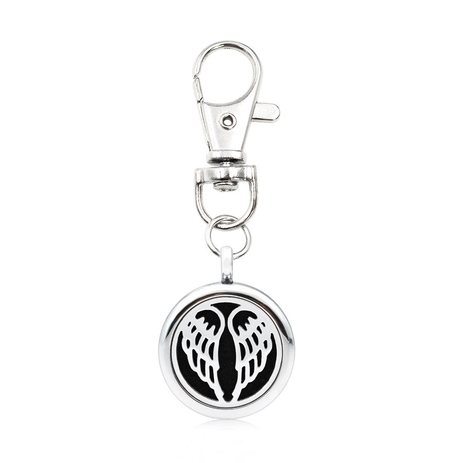 Wholesale Alloy Angel Wings Hollow Aromatherapy Essential Oil Keychain